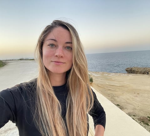 A portrait of Christy doing one of her favourite activities: walking near the beach.