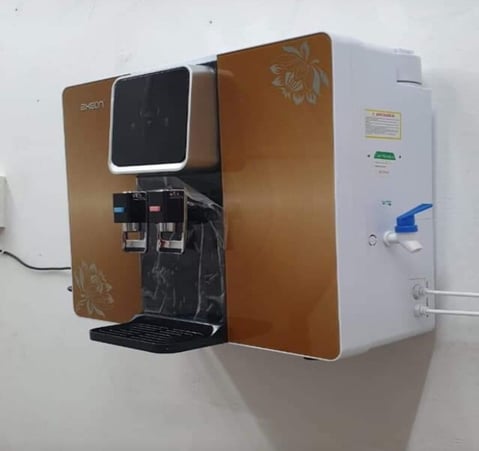 a hot cold normal water dispenser with a water purifier