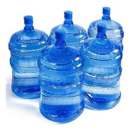 a group of three large water bottles with water in them