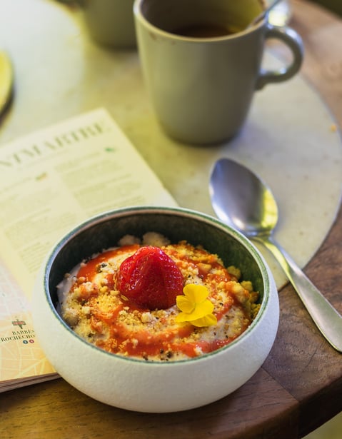 a bowl of oatmeal with a strawberry pie