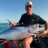 man and yellowfin tuna on boat in Zanzibar