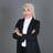 a woman in a suit and hijab