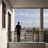 man standing near balcony