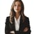 a woman in a black suit and white shirt