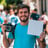 a man holding a camera and a camera
