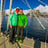 a couple standing on a sailing yacht in a ski and sail advenure in Norway | Jolly Good Times Sailing