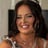 Smiling Bedfordshire bride with dark hair and tiara, in a lace wedding dress and pearl necklace, Liberty Photo Photography
