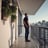 man standing near balcony