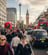 a busy street in UK with a lot of people walking around
