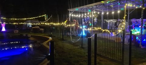 Backyard 18th birthday party with the glow bar and glow cocktail tables lighting up the night in Redlands