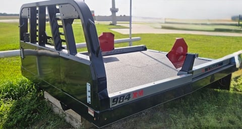 a truck with a red stop sign on the back of it