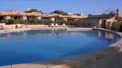 Hotel poo, withs sun loungers.