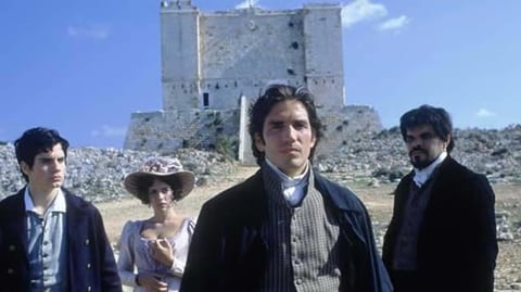 Agroup of people standing in front of a tower.