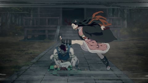 Nezuko kicks demon's head off