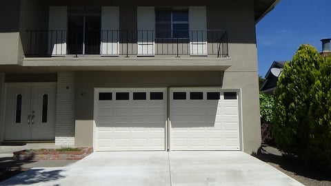 2 short panel garage doors with glass.