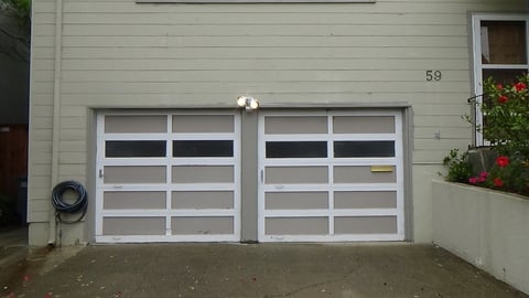 2 wood garage doors side by side.