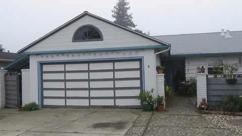 Wood garage door before replacement.