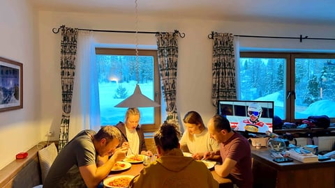 a group of people sitting around a table