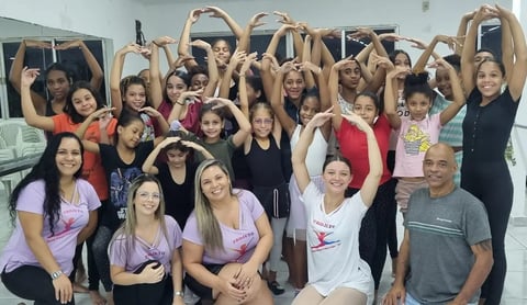 a group of people standing in front of a mirror