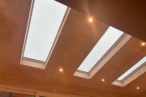 FRESHLY PLASTERED CEILING WITH SKYLIGHT