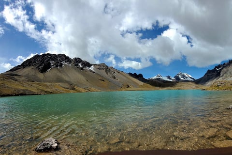 a lake with a mountain in the background