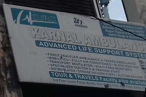 An image showing a board with details of Karnal Ambulance Service in Karnal