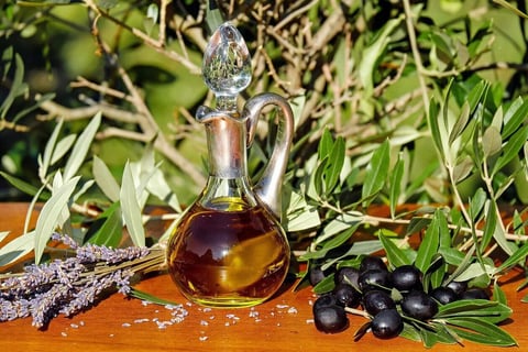 olive oil flask with olives and lavender