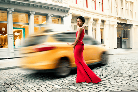 a woman in a red dress standing in front of a taxi