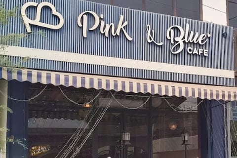 An image showing facade of Pink and Blue cafe