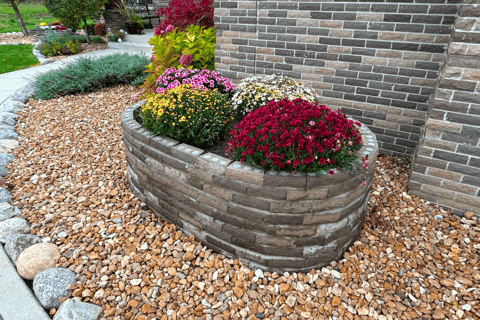 a brick wall with a circular window and a brick wall