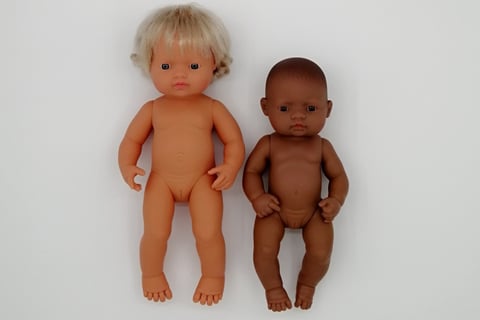 a 38cm Miniland doll next to a 32cm Miniland doll