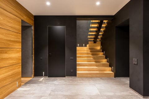 a staircase leading to a wooden staircase