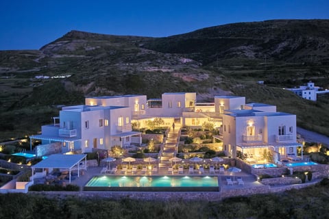 a large house with a pool and a pool Milos Breeze Boutique Hotel 