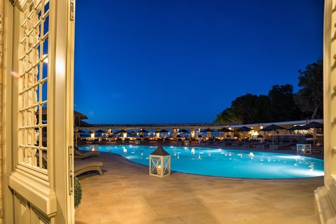 a pool with a view of the pool and the ocean Saint Andrea Seaside Resort Paros