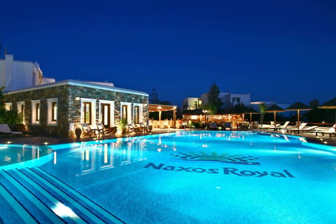 a pool with a blue sky and a blue sky from Naxos Resort Beach Hotel in Naxos