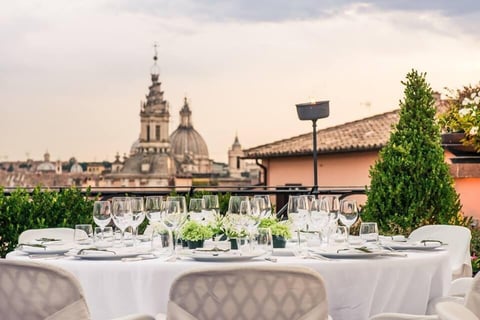 a table with a table setting with a view of a city