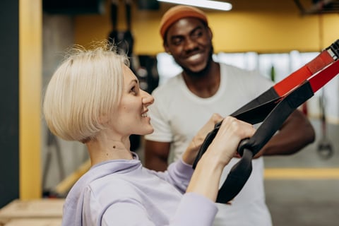 a woman in a white shirt exercising