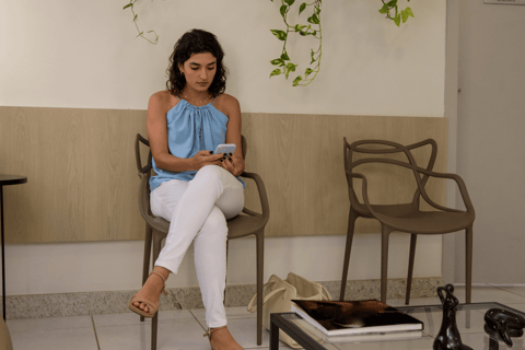 Woman waiting for her first fertility consultation in a clinic lobby