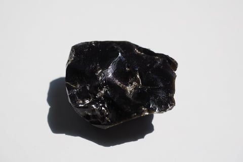 obsidian rock with a black stone on it from Tenerife