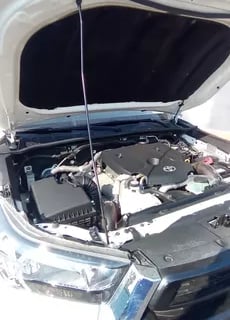a car with a hood up and a hood up