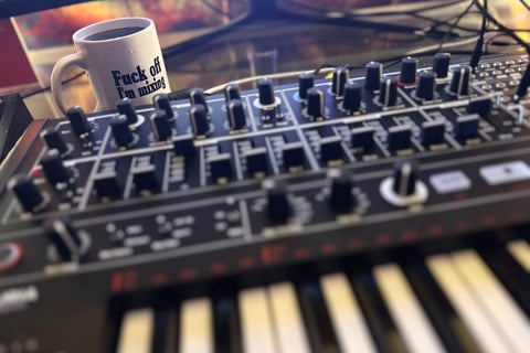 MiniBrute 2 On Desk with Fuck Off I'm Mixing Mug