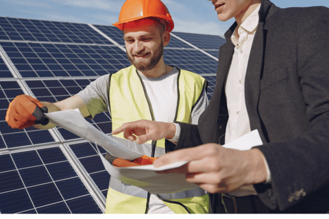 Solar technician answering questions for a client