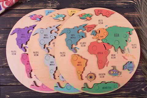 a wooden puzzle puzzle board with a map of the world