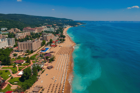 a beach with a view of a beach and a blue sky