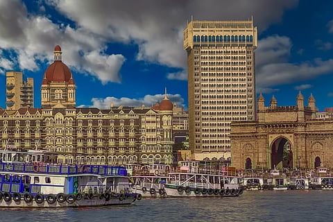  A modern image of the Taj Mahal Palace today, beautifully lit at night with the Gateway of India in