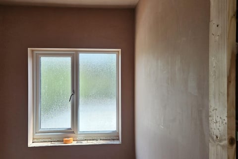 WINDOW IN A FRESHLY PLASTERED ROOM