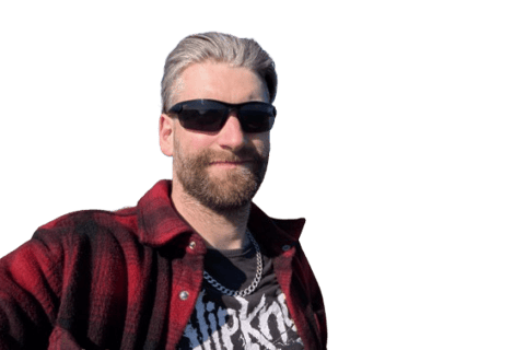 Ryan McCormack smiling with Sunglasses on