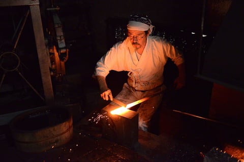 Japanese Blacksmith forging a katana