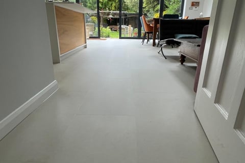 A tile effect LVT floor in an open plan kitchen