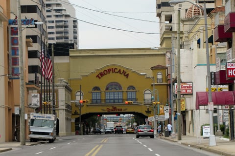 a city street scene with a bus stop sign